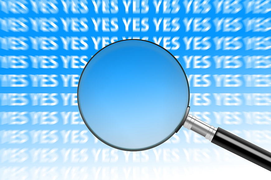 Magnifying glass over repeating yes text pattern on blue background