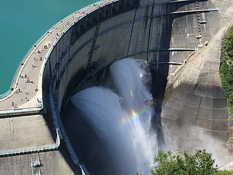 Aerial View of Kurobe Dam Spillway with Rainbow and Waterfall
