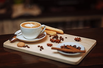 Cappuccino with Latte Art, Spices, and Biscuits on Wooden Board