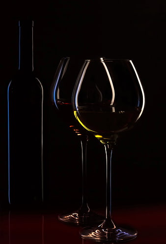 Silhouette of Wine Glasses and Bottle on Dark Background