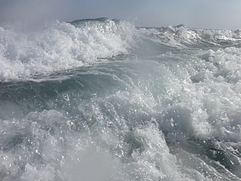 Crashing ocean waves with white foam and sea spray