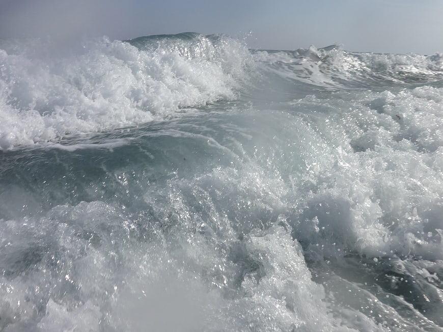 Crashing ocean waves with white foam and sea spray