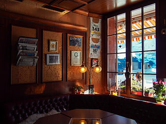 Cozy Alpine Cafe Interior With Mountain View Through Window
