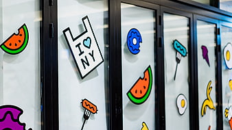 Colorful food stickers on modern kitchen cabinet doors