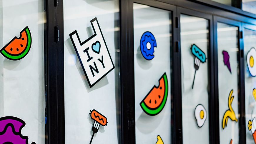 Colorful food stickers on modern kitchen cabinet doors