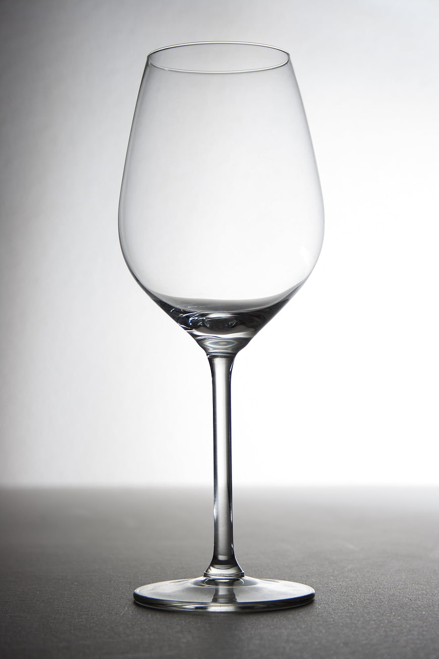 Empty Crystal Wine Glass on Gray Background