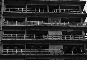 Black and white photo of unfinished concrete building facade