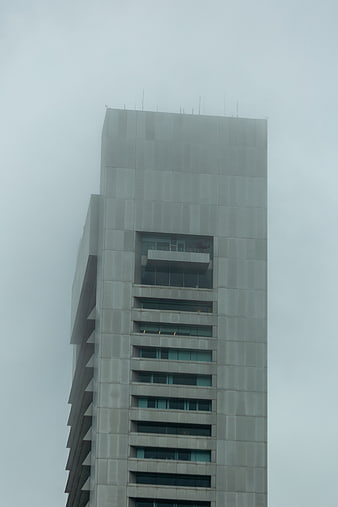 Modern Skyscraper Tower in Thick Fog