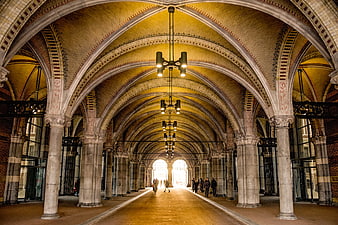 Grand Arched Hallway with Brick Ceiling and Stone Columns