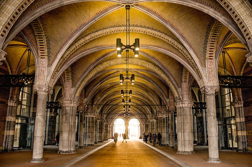 Grand Arched Hallway with Brick Ceiling and Stone Columns