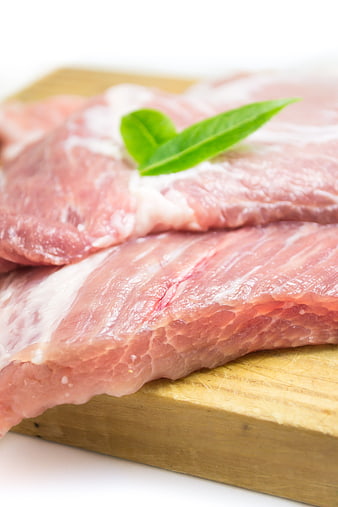Fresh Raw Pork Loin on Wooden Cutting Board