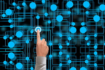 Hand touching glowing blue digital network nodes on black background