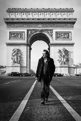 Man Walking in Front of Arc de Triomphe Paris