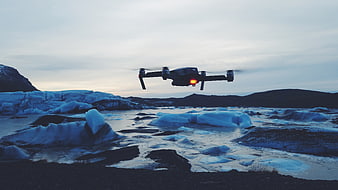 Drone Flying Over Glacial Lagoon with Icebergs