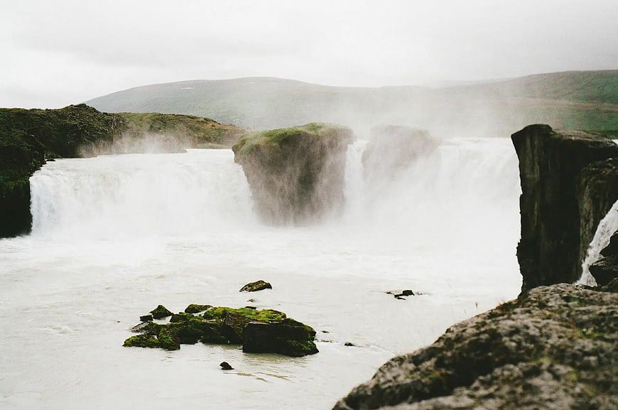 Majestic Goðafoss Waterfall in Iceland Under Overcast Sky