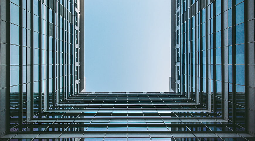 Low angle view of modern glass skyscraper architecture