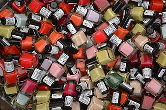 Colorful pile of assorted nail polish bottles