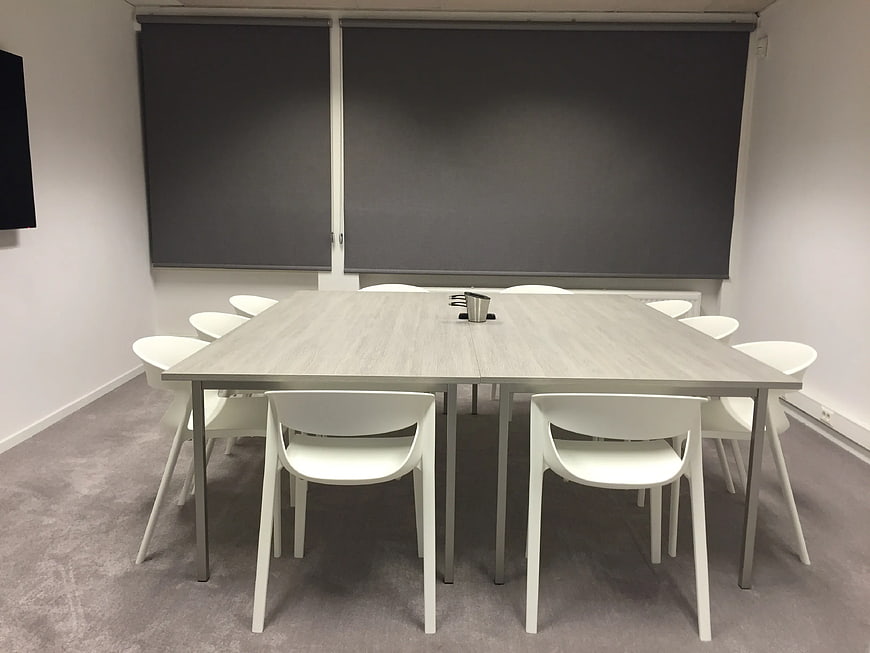 Modern Empty Conference Room with Wooden Table and White Chairs
