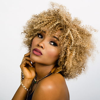 Portrait of Woman with Blonde Curly Hair and Gold Jewelry