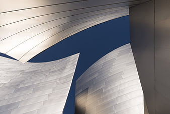 Abstract Modern Architecture Detail With Curved White Facade And Blue Sky