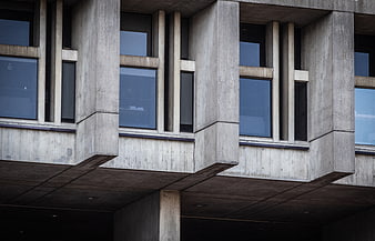 Brutalist concrete building facade with geometric windows