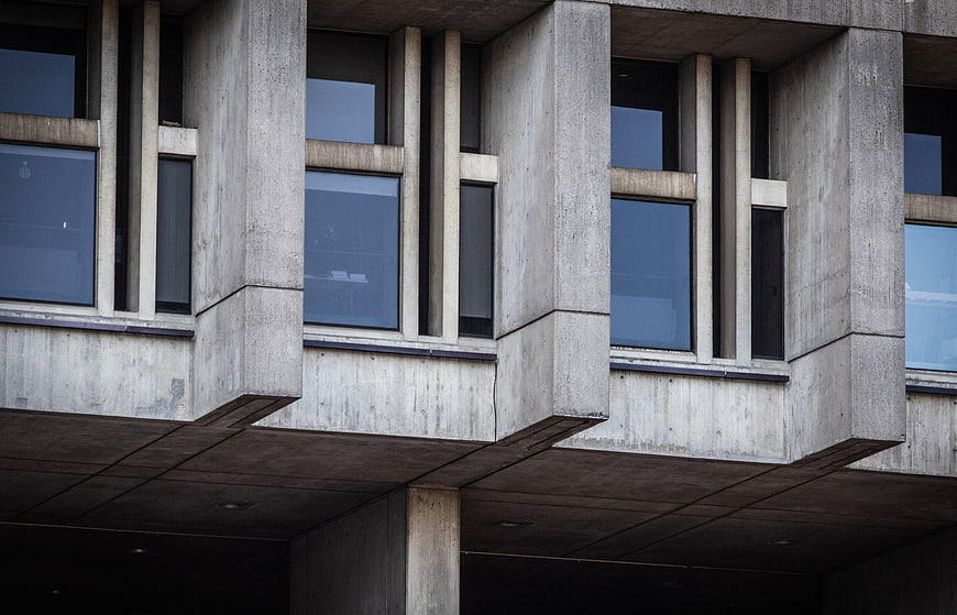Brutalist concrete building facade with geometric windows
