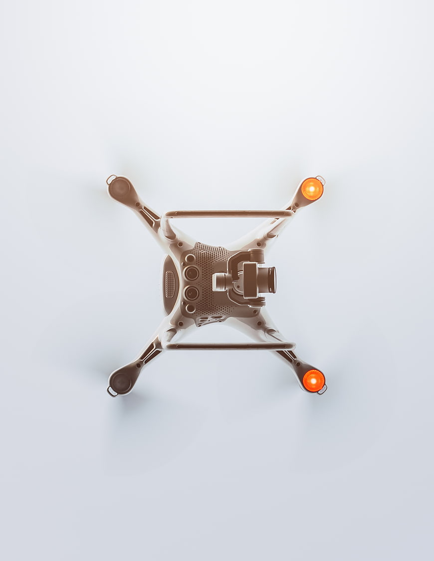 Top View of White Drone with Camera on White Background