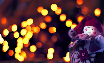 Christmas Elf Figurine With Festive Bokeh Lights
