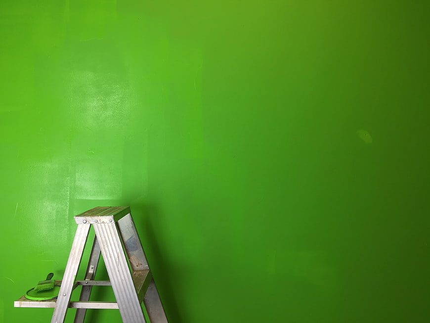 Green Screen Wall with Ladder and Paintbrush