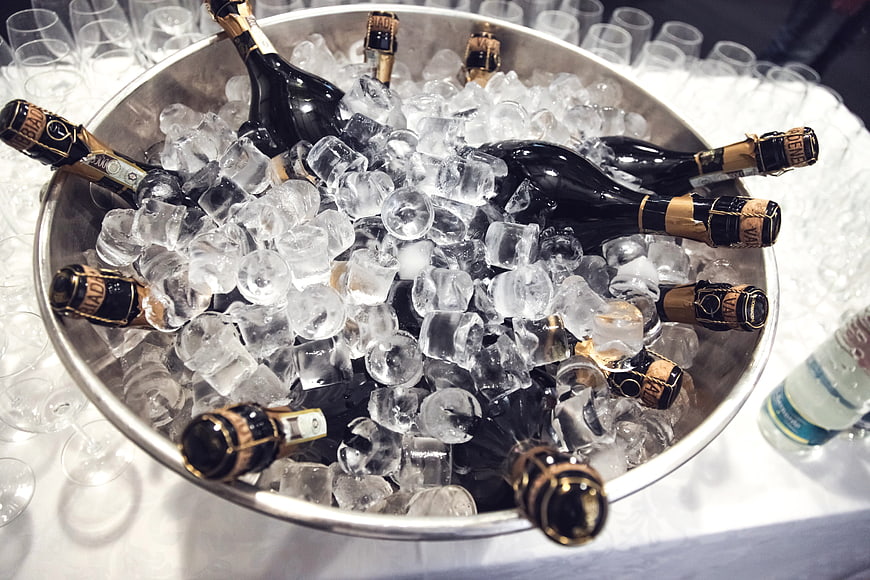 Champagne bottles chilling in ice bucket for celebration