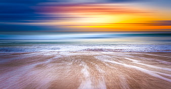 Long Exposure Sunset Beach with Smooth Ocean Waves
