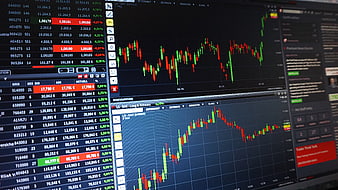 Stock market trading charts on computer monitor screen