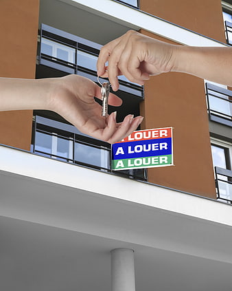 Handing over apartment keys with French rental signs