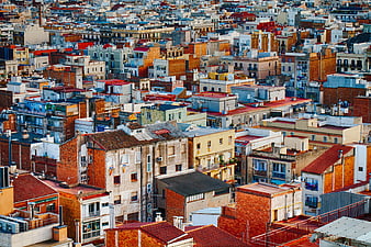 Aerial View of Colorful Urban Rooftops and Dense Cityscape