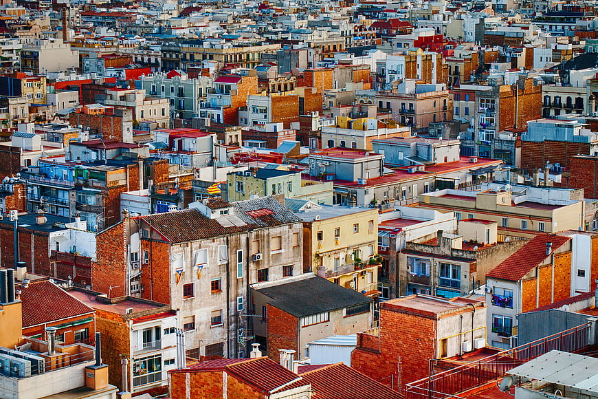 Aerial View of Colorful Urban Rooftops and Dense Cityscape