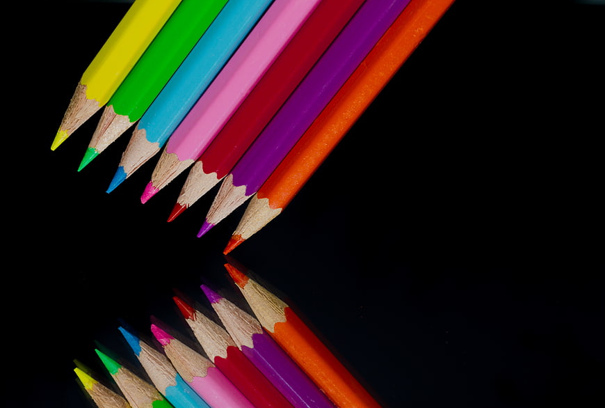 Colorful Pencils with Reflection on Black Background