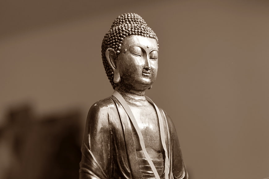 Serene Buddha Statue in Sepia Tone
