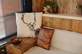 Rustic Interior with Deer Print Pillow and Wooden Decor
