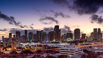 Miami Skyline at Dusk with City Lights and Clouds
