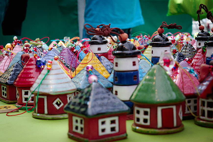 Colorful ceramic miniature houses and lighthouses for sale