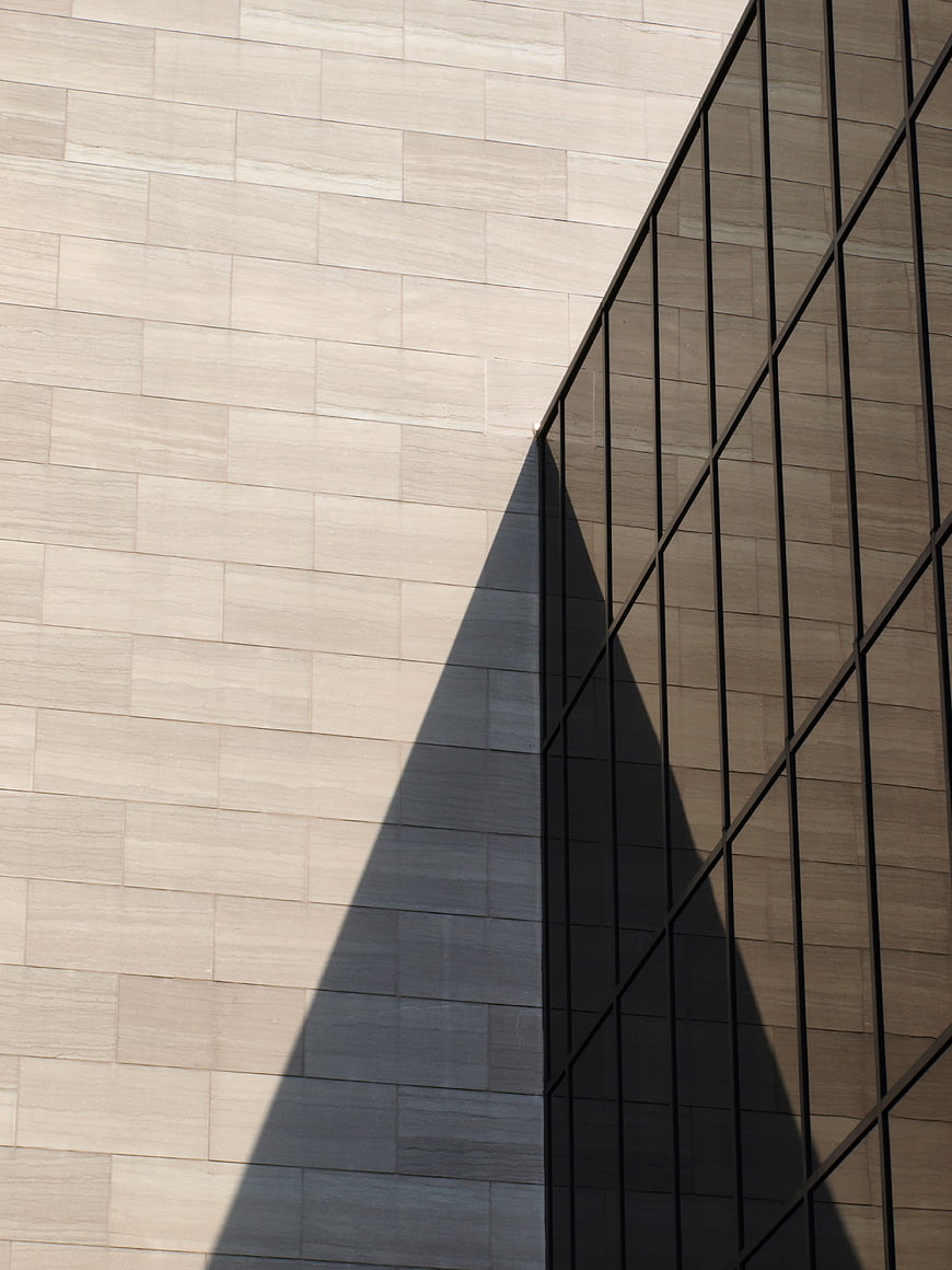 Modern architectural facade with geometric shadow pattern