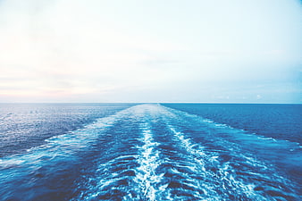 Boat Wake Trail on Calm Blue Ocean Sea