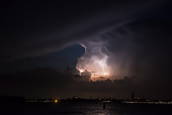 Dramatic Lightning Storm Over Venice Skyline at Night