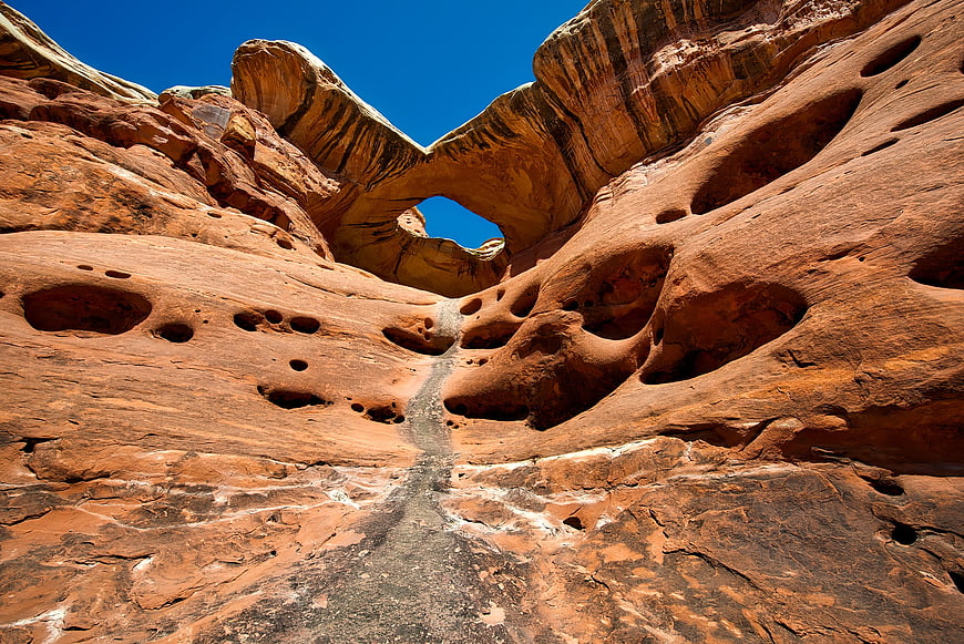 Natural sandstone arch in red rock desert landscape