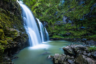Serene Mossy Waterfall in Lush Green Forest