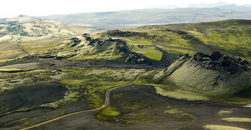 Winding dirt road through volcanic landscape in Iceland