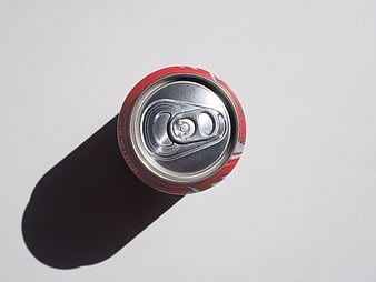 Top Down View of Red Soda Can with Hard Shadow on White Background