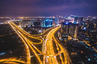 Aerial Night View of Vietnam City Highway Interchange and Urban Skyline