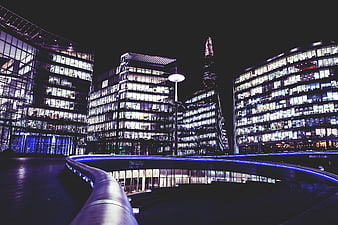 Night view of The Scoop and The Shard in London