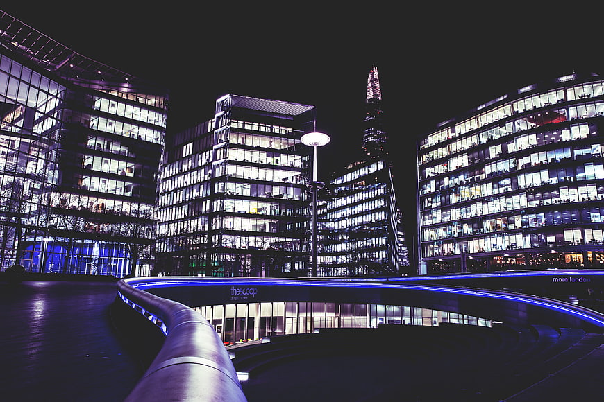 Night view of The Scoop and The Shard in London
